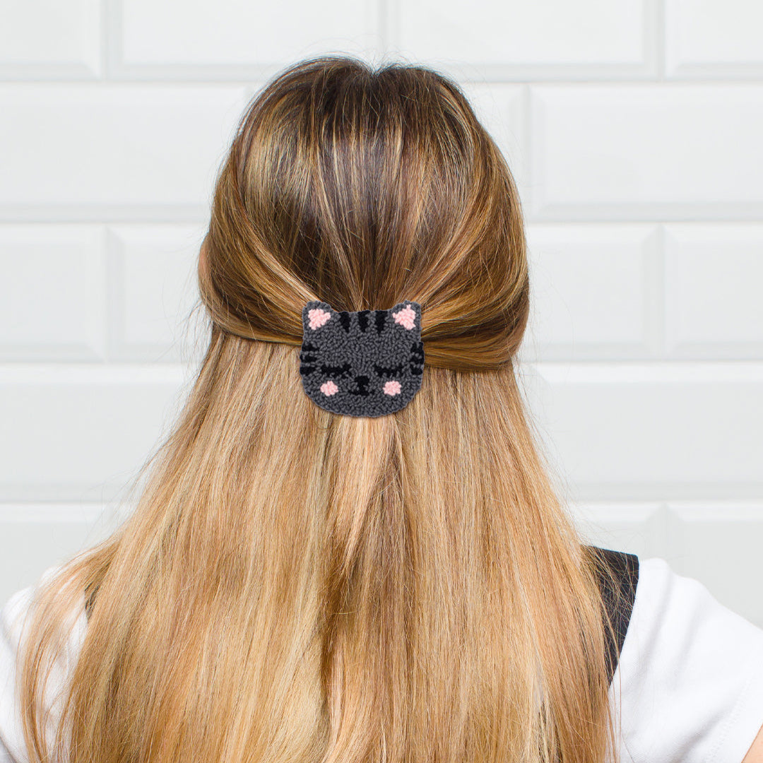 Handmade blush cheek dark grey cat punch needle hair clip worn in hair