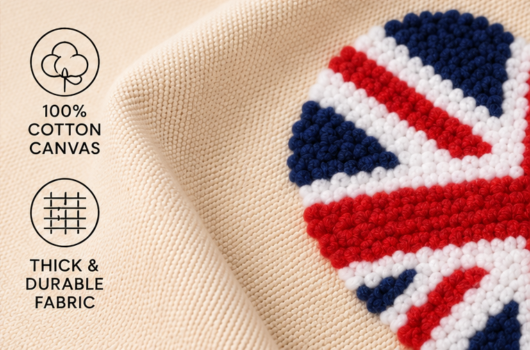Close-up of a cream-colored woven fabric with a Union Jack flag motif in red, white, and blue. Text on the left highlights 100% cotton canvas and thick durable fabric.