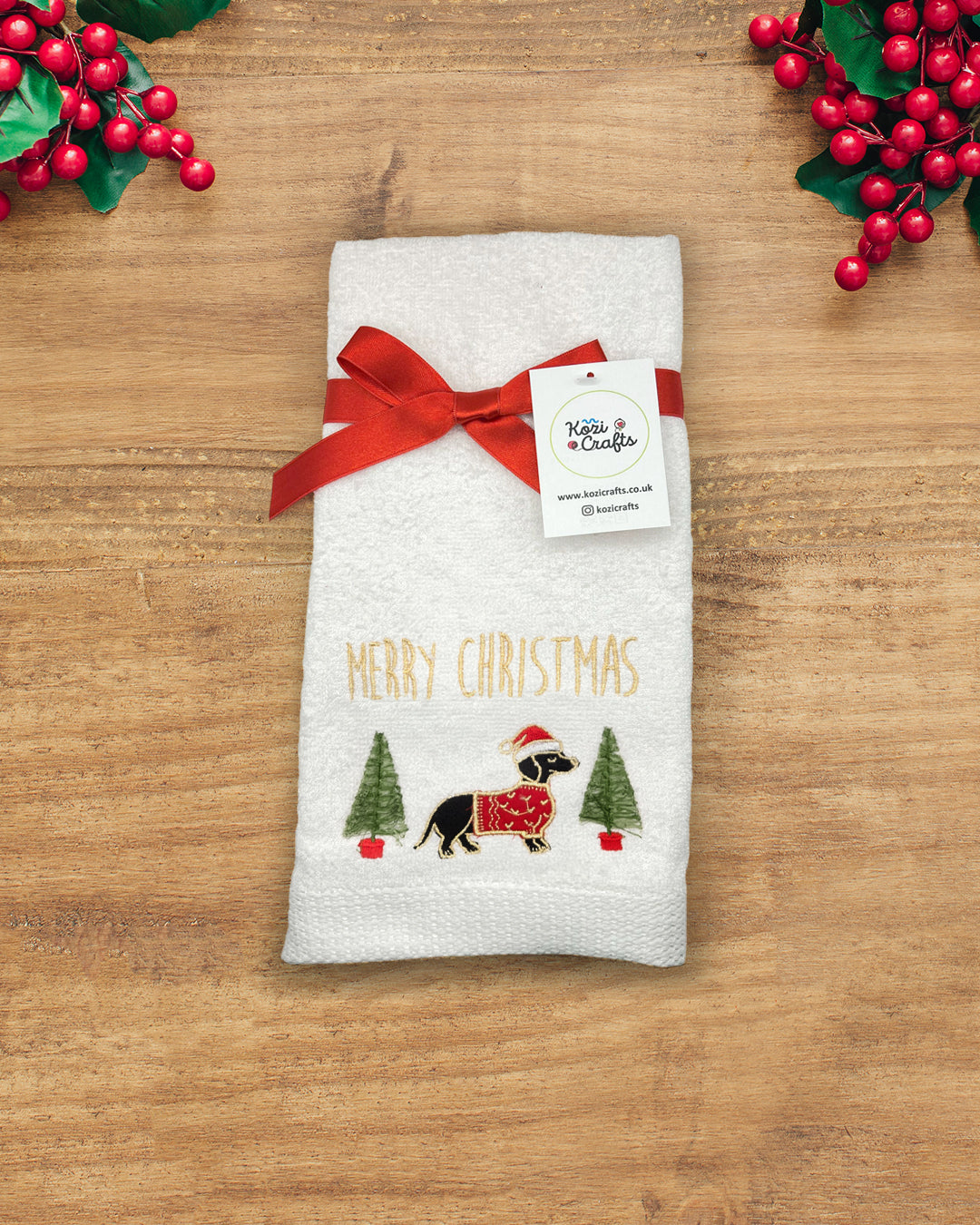 Christmas hand towel in 100% cotton with stitched festive design - sausage dog