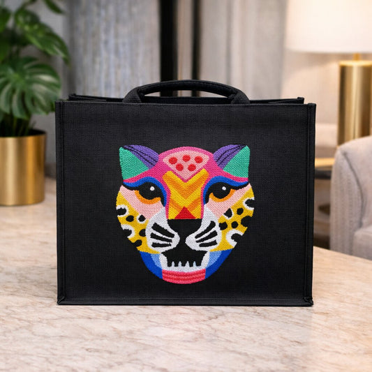 Handmade jute colourful tiger shoulder bag with punch needle design, structured black base and water-resistant lining. 35 x 45 cm.