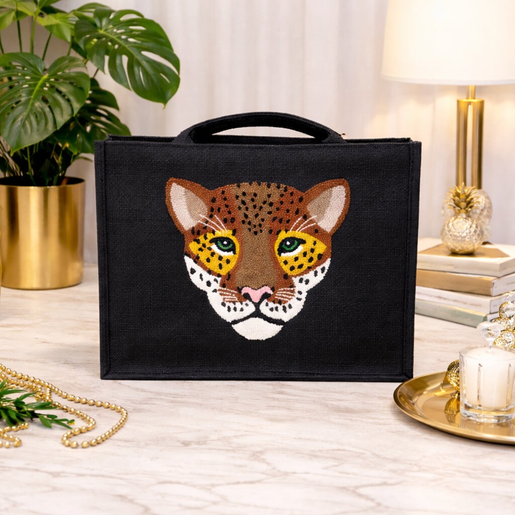 Jute leopard shoulder bag with handmade punch needle design on black structured base