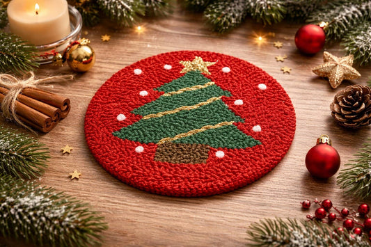 Christmas tree punch needle coaster on wooden table