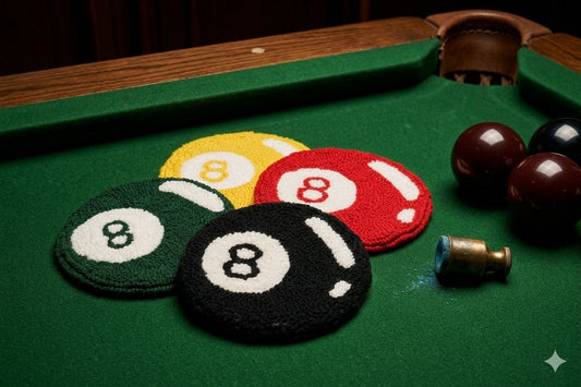 8 ball punch needle coaster on a table with a drink