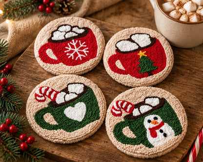 Four round beige textured coasters with festive holiday mug designs, arranged on a rustic wooden surface with pine branches, red berries, and a cup of marshmallows nearby.
