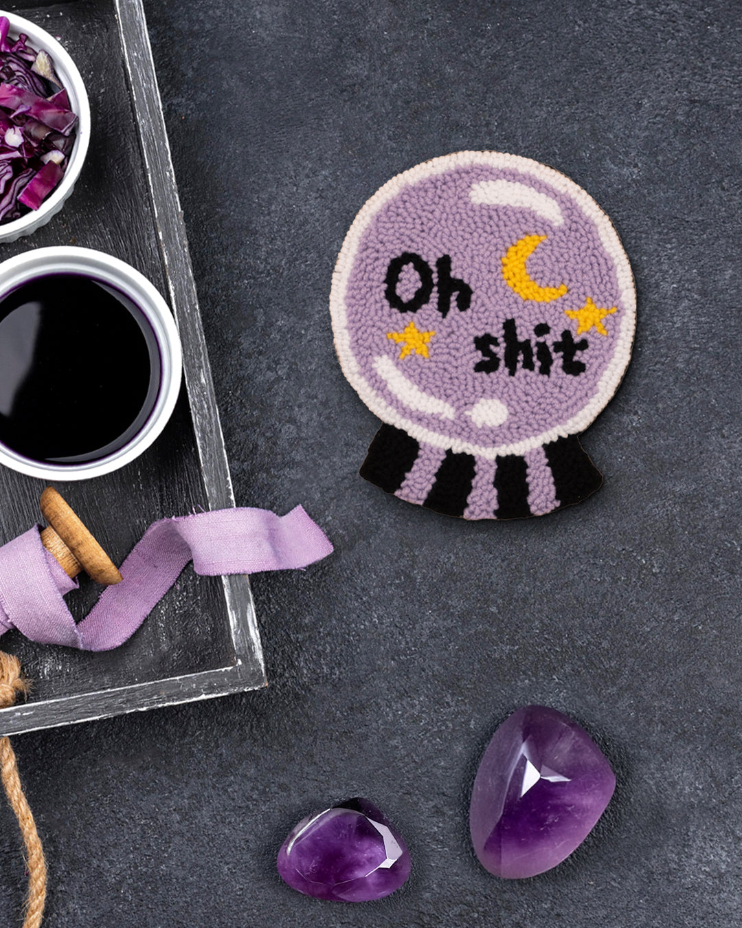 Round crystal ball punch needle coaster with “OH SHIT” text by Kozi Crafts
